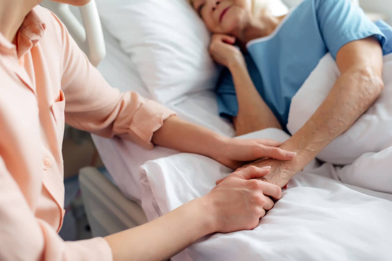 What it means to “hold space” as daughter holds dying mother's hand